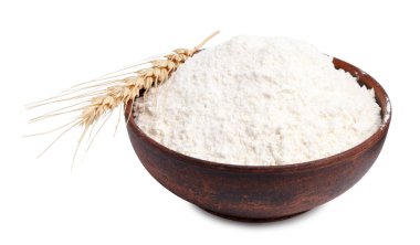 Kasede buğday unu ve beyaz arka planda çivi.