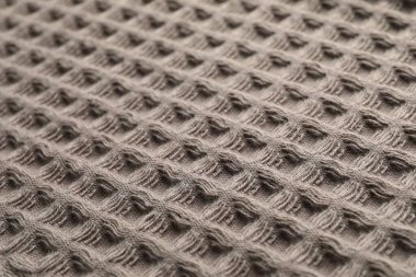 Arka plan olarak temiz kahverengi waffle havlusu, yakın plan