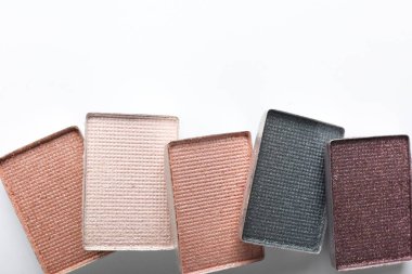 Beautiful eye shadow refill pans on white background, flat lay. Space for text
