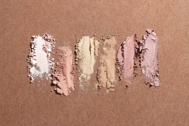 Kahverengi arka planda farklı göz farı lekeleri, düz yatış