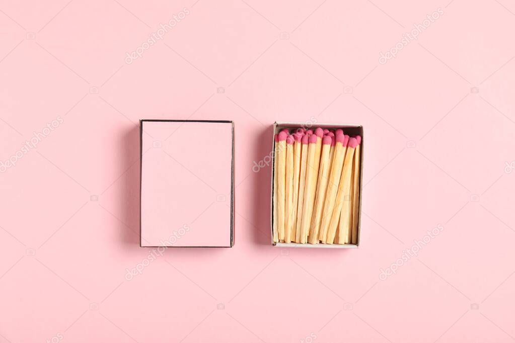 Matches and box on pink background, flat lay. Mockup for design