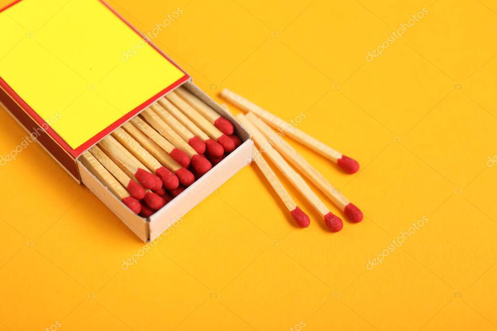 Matches and box on yellow background, closeup. Mockup for design