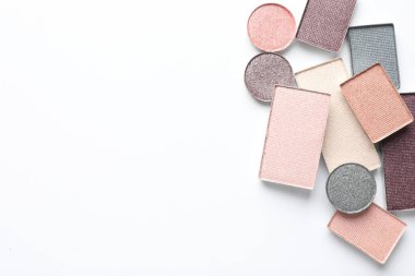 Beautiful eye shadow refill pans on white background, flat lay. Space for text