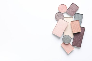 Beautiful eye shadow refill pans on white background, flat lay. Space for text