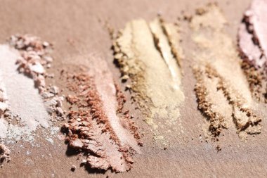 Kahverengi arka planda farklı göz farı lekeleri, yakın plan.