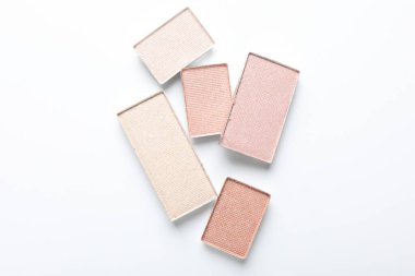 Beautiful eye shadow refill pans on white background, flat lay