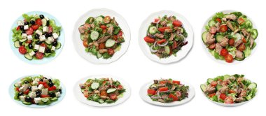 Beyaz arka planda lezzetli taze salatalar, kolaj. Üst ve yan görünüm