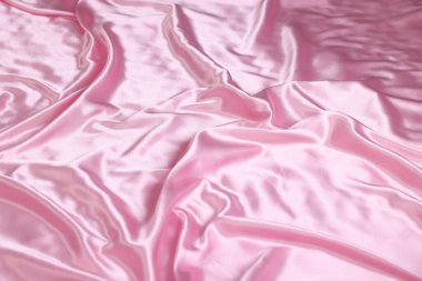 Arka plan olarak lüks pembe ipek çarşaflar, yakın plan