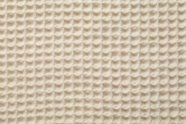 Arka plan olarak temiz bej waffle havlusu, üst görünüm