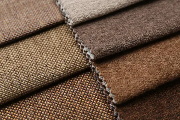 Arka plan olarak farklı kumaşlardan örnekler, yakın plan