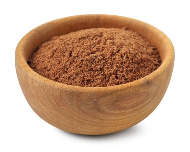 Beyaz kabın içindeki nutmeg tozu.