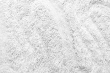 Arkaplan olarak beyaz kürklü kumaşın dokusu, yakın plan