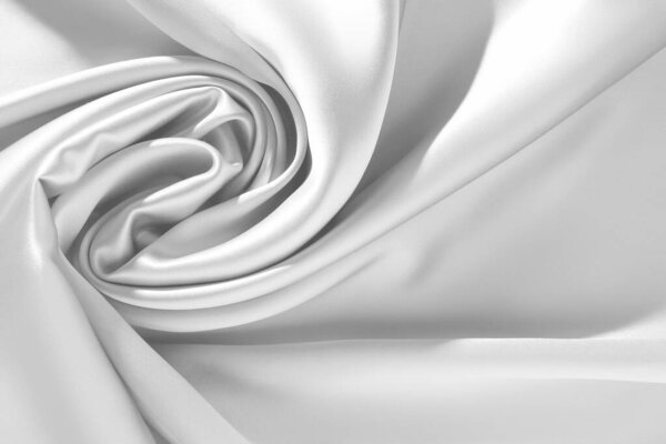 Текстура белой шелковой ткани в качестве фона, вид сверху