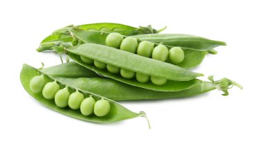 Beyaz kabuklarda taze yeşil bezelyeler.