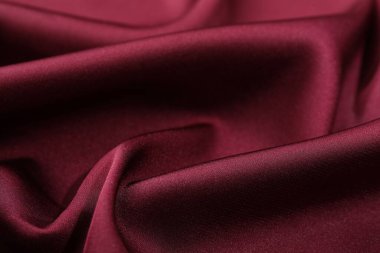 Buruşuk bordo ipek kumaş arka plan olarak, yakın plan