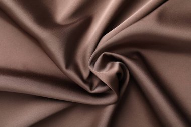 Arkaplan olarak buruşuk açık kahverengi ipek kumaş, üst görünüm