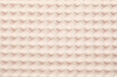 Arka plan olarak temiz bej waffle havlusu, üst görünüm