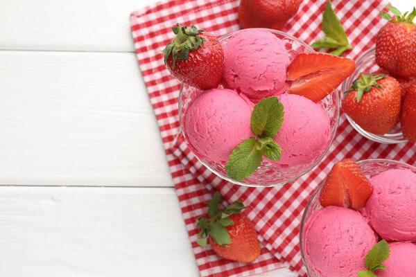 Refreshing sorbet, strawberries and mint on white wooden table, top view. Space for text