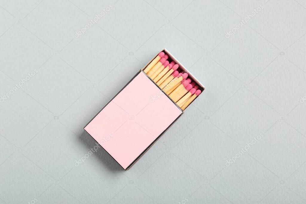 Matches in box on grey background, top view. Mockup for design