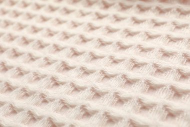 Arka plan olarak temiz bej waffle havlusu, yakın plan