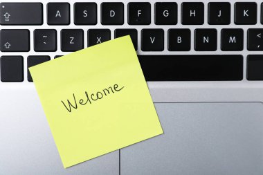 Kağıt nota kelime ile Hoşgeldiniz, üst görünüm