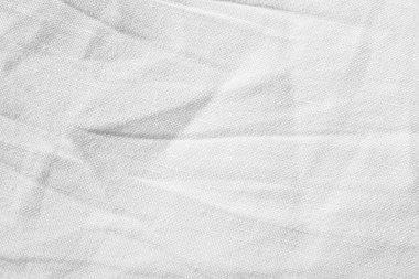 Arkaplan olarak beyaz kumaşın dokusu, üst görünüm