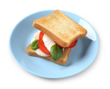 Beyaz arka planda mozarella peynirli, domatesli ve fesleğenli lezzetli sandviç.