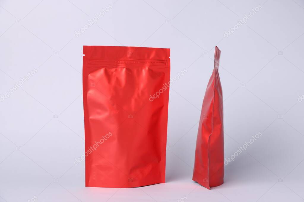 Zipper stand-up pouches on light grey background. Mockup for design
