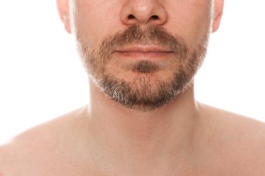 Man with beard on white background, closeup