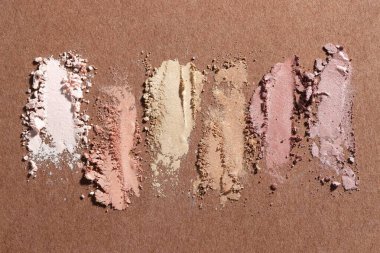 Kahverengi arka planda farklı göz farı lekeleri, düz yatış