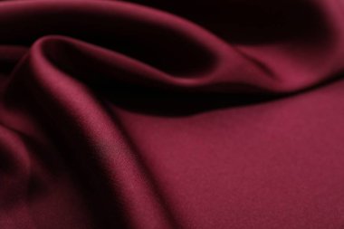 Buruşuk bordo ipek kumaş arka plan olarak, yakın plan