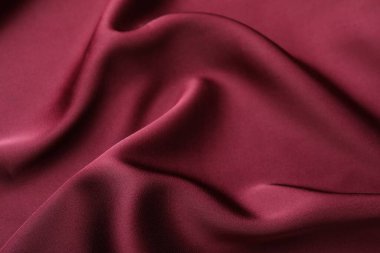 Buruşuk bordo ipek kumaş arka plan olarak, yakın plan