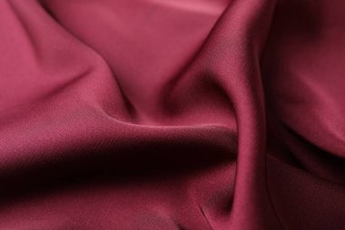 Buruşuk bordo ipek kumaş arka plan olarak, yakın plan