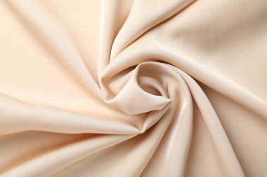 Arkaplan olarak buruşuk bej ipek kumaş, üst görünüm