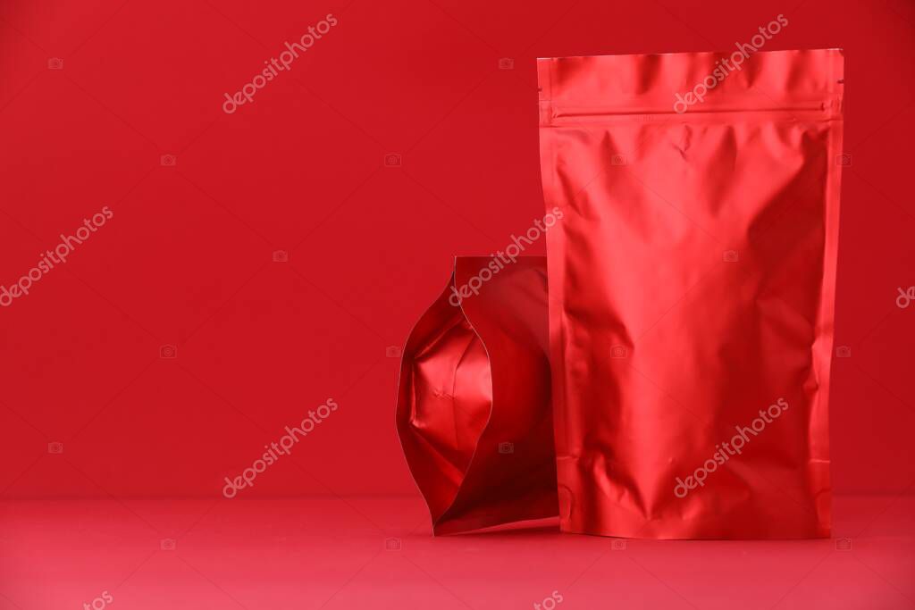 Zipper stand-up pouches on red background. Mockup for design