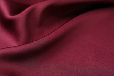 Buruşuk bordo ipek kumaş arka plan olarak, yakın plan