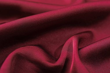 Buruşuk bordo ipek kumaş arka plan olarak, yakın plan