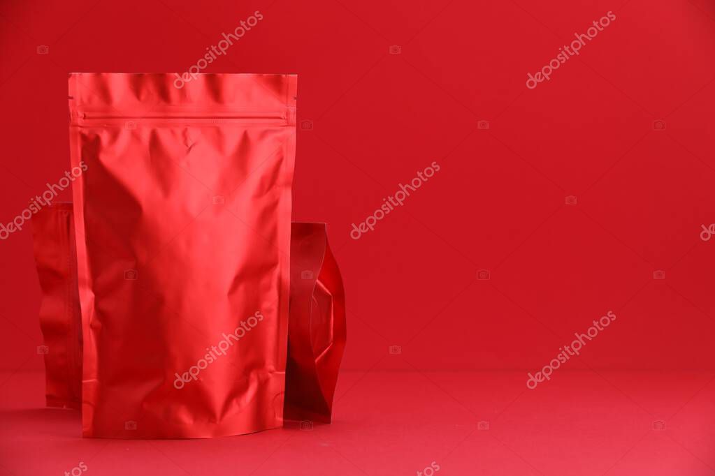Zipper stand-up pouches on red background. Mockup for design