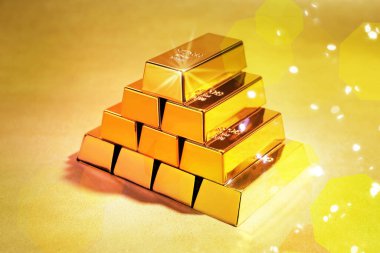 Renk arkaplanına yerleştirilmiş parlak altın çubuklar