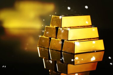 Ayna yüzeyine yığılmış parlak altın külçeler. Metin için boşluk