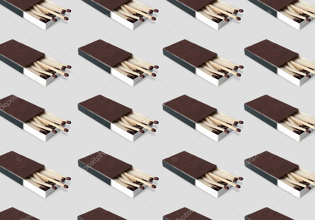 Cardboard box with matches on light grey background, pattern design