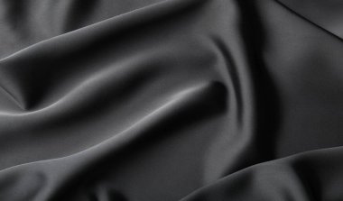 Arkaplan olarak buruşmuş siyah ipek kumaş, üst görünüm