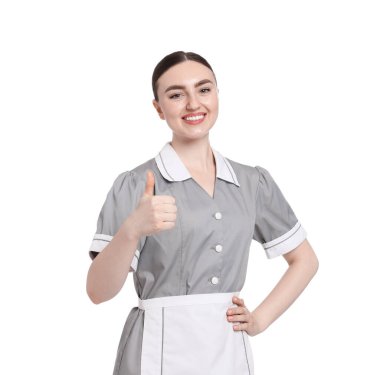 Mutlu oda hizmetçisi beyaz arka planda baş parmak gösteriyor.