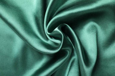Arkaplan olarak buruşmuş yeşil ipek kumaş, üst görünüm
