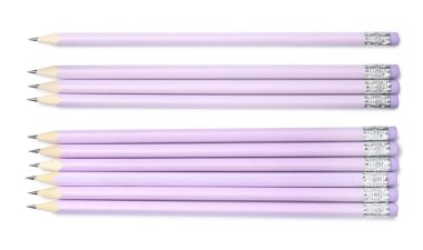 Beyaz zemin üzerinde birçok grafit kalem, set. Üst görünüm