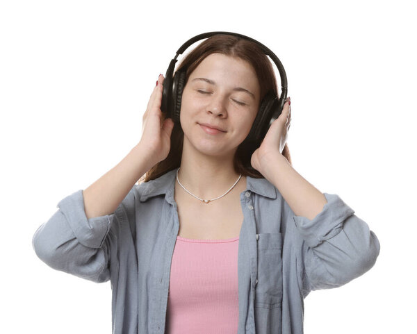 Teenage girl in headphones on white background
