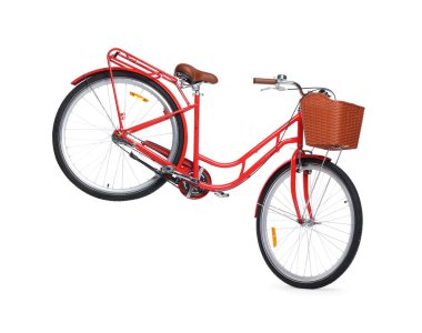 Beyaz arka planda sepeti olan bir bisiklet.