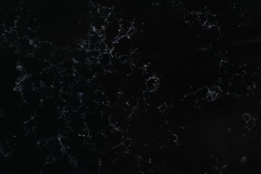 Arkaplan olarak siyah mermer yüzey dokusu, üst görünüm