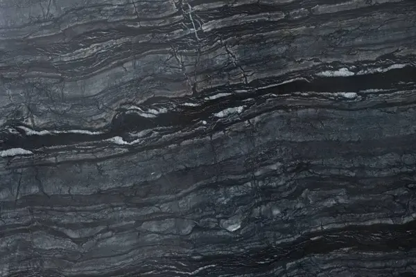 Arkaplan olarak koyu mermer yüzeyin dokusu, üst görünüm