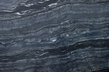 Arkaplan olarak koyu mermer yüzeyin dokusu, üst görünüm